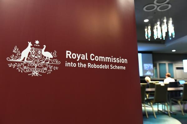 A wall saying Royal Commission into the Robodebt Scheme